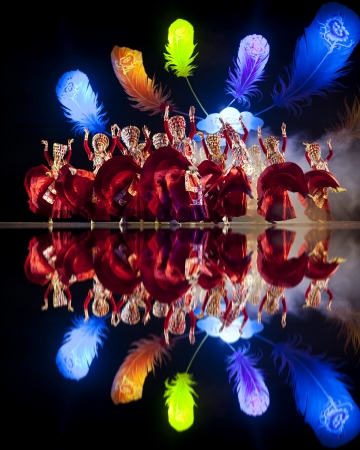 CHENGDU - OCT 17: Chinese Yi national dancers perform folk dance on stage at JINCHENG theater on Oct 17, 2011 in Chengdu, China.のeditorial素材