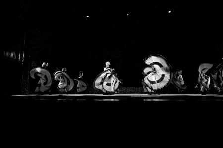 CHENGDU - SEP 28: chinese Yi ethnic dancers perform on stage in the 6th Sichuan minority nationality culture festival at JINJIANG theater.Sep 28,2010 in Chengdu, China.のeditorial素材