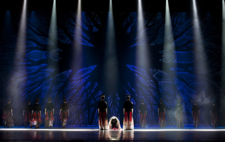 CHENGDU - OCT 18: Chinese Yi national dancers perform contemporary dance on stage at JINCHENG...