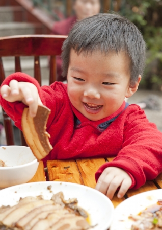 a cute baby is eatingの写真素材