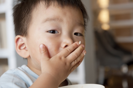 Baby boy eatingの写真素材