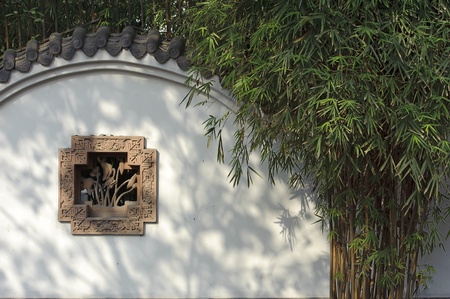 The bamboo cast its shadow on the wallの写真素材