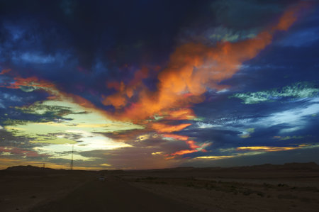 crimson clouds at sunset with vivid coloring over the Sahara desert の写真素材