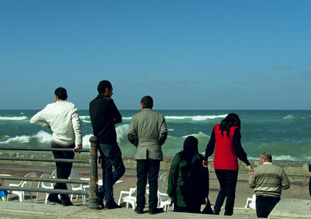 ALEXANDRIA - JAN 27: Egyptians looking landscape at seaside of Mediterranean in Alexandria in Alexandria.Jan 27,2013 in Alexandria,Egypt.のeditorial素材