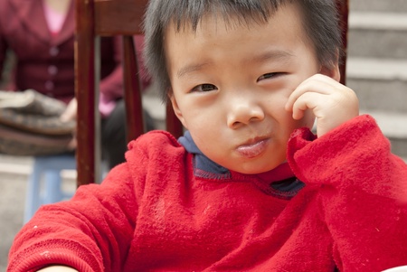 a cute baby is eatingの写真素材