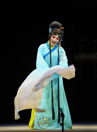 CHENGDU - JUN 4: chinese Sichuan opera performer make a show on stage to compete for awards in 25th Chinese Drama Plum Blossom Award competition at Xinan theater.Jun 4, 2011 in Chengdu, China.Chinese Drama Plum Blossom Award is the highest theatrical awaのeditorial素材