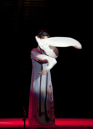 CHENGDU - JUN 4: chinese Sichuan opera performer make a show on stage to compete for awards in 25th Chinese Drama Plum Blossom Award competition at Xinan theater.Jun 4, 2011 in Chengdu, China.Chinese Drama Plum Blossom Award is the highest theatrical awaのeditorial素材