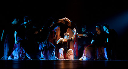 CHENGDU - OCT 17: Chinese Yi national dancers perform contemporary dance on stage at JINCHENG theater on Oct 17, 2011 in Chengdu, China.のeditorial素材