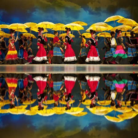 CHENGDU - SEP 26: chinese Yi ethnic dancers perform on stage at JIAOZI theater.Sep 26,2010 in Chengdu, China.のeditorial素材