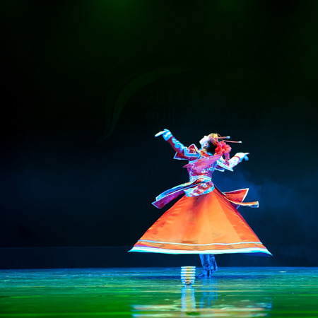 CHENGDU - APR 11: tibetan solo dance "Bowl Dance" performed by Ganzi National Song and Dance troupe at sichuan song and dance theater in the new works for 2013 dance competition in Sichuan. Apr 11, 2013 in Chengdu, China.のeditorial素材