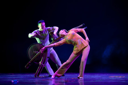 CHENGDU - APR 11: Sichuan song and dance troupe perform modern duo dance Companion at sichuan song...