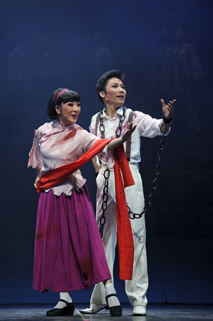 CHENGDU - JUN 7: Chinese Yue opera performer make a show on stage to compete for awards in 25th Chinese Drama Plum Blossom Award competition at Shengge theater.のeditorial素材