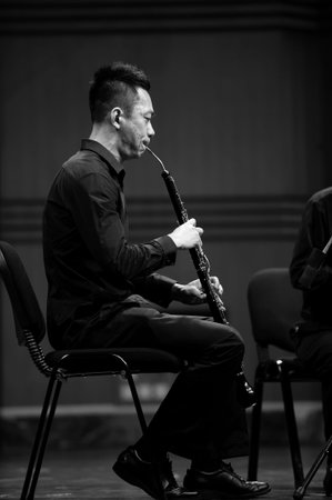 CHENGDU - JUN 20: musician performs English horn on wind music chamber music concert at odeum of...