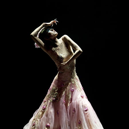 CHENGDU - SEP 23: chinese famous dancer Yang Liping performs Peacock Dance on stage at Jincheng theater.のeditorial素材