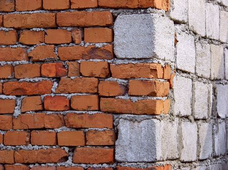 A corner house with stones and bricksの写真素材