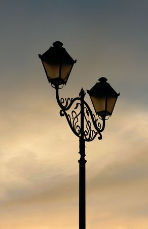 Lantern on the background sky at sunsetの写真素材