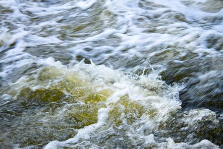 The rapid flow of river water instantlyの写真素材