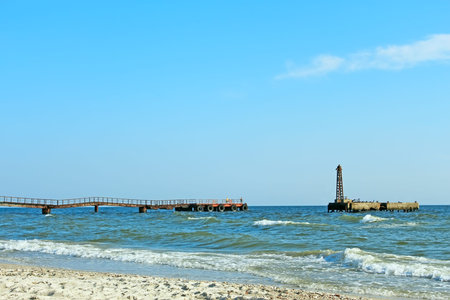 An old sea pier in fine summer dayの写真素材