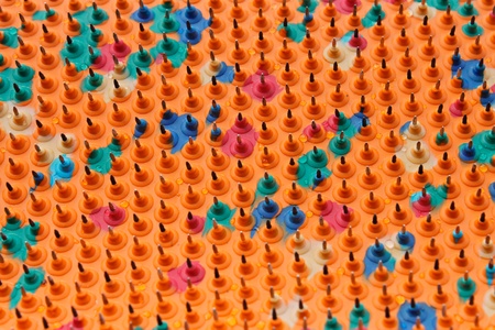 Periodic structure with bases of multicolored rubber and metal needles. Drops of water on the surface. Used in Medicineの写真素材