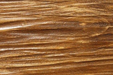 Relief wooden board surface is coated with varnishの写真素材