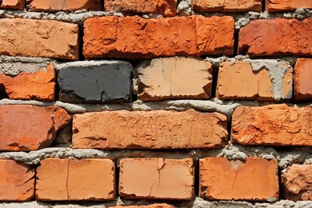 Detail of brick wall with bricks of different colorsの写真素材