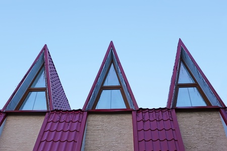 Detail of the roof covered with metal tile in evening lightの写真素材