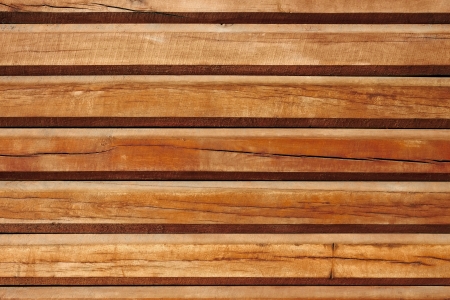 Horizontal parallel old wooden logs. Part of traditional wooden house wallsの写真素材