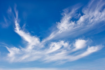 Beautiful sky scenery with different white cloudsの写真素材