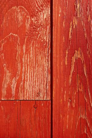Fragment of painted in red old wooden shieldの写真素材