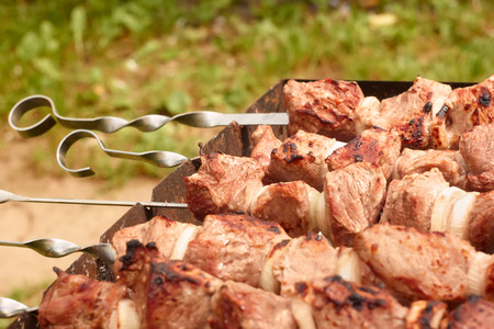 Shashlik (shish kebab) prepared on the metal skewers close uの写真素材
