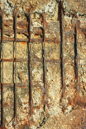 Detail of old outdated reinforced concrete structures with rusty iron rods outsideの写真素材