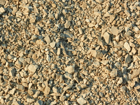 Crushed stone in bright sunlight as a textureの写真素材