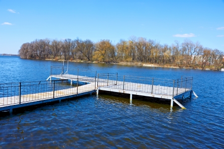 Wooden pier for small river boats an early springtime  Khmelnytsky, Ukraineの写真素材