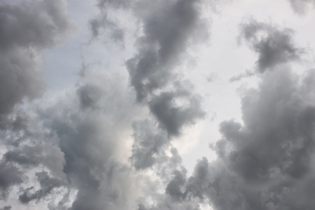 Grey tragic cloudscape with various density chaotic thundercloudsの写真素材