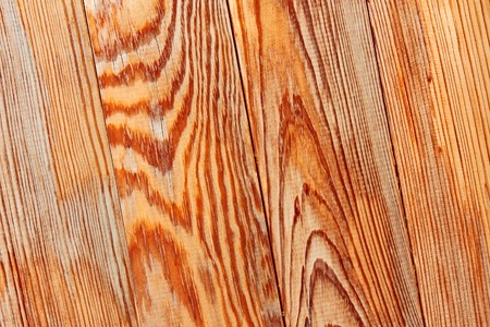 Wooden shield with parallel lacquered whiteboards in sunlight, close upの写真素材