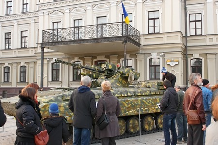 KYIV, UKRAINE - OCTOBER 17, 2015: Exhibition of military equipment "Power Unconquered" in October 17, 2015 on St. Michael's square in the downtown of Kyiv, Ukraine. People looking a combat vehicle on tracksのeditorial素材