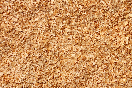 Fine yellowish sawdust as a texture, macro photoの写真素材