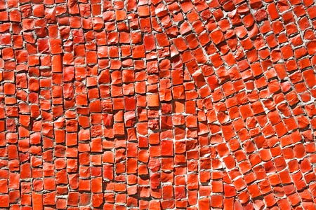 Fragment of mosaic with small red stones in the bright sunlight, close-upの写真素材