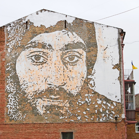 KYIV, UKRAINE - MARCH 13, 2016: Graffiti in honor of Serhii Nihoian, ethnic Armenian who died during the Revolution of Dignity in Kyiv on January 22, 2014. Graffiti performed by Portuguese artists group led by Alexandre Farto (VHILS), Mykhaylivska Street,のeditorial素材