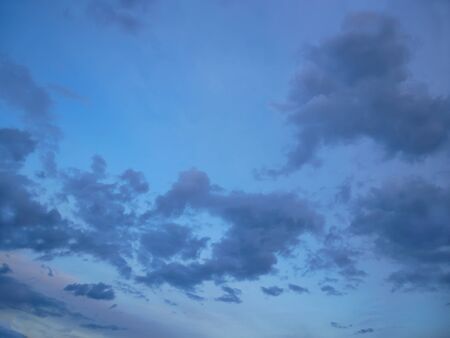 Bright bluish cloudscape in autumn evening as a backgroundの写真素材