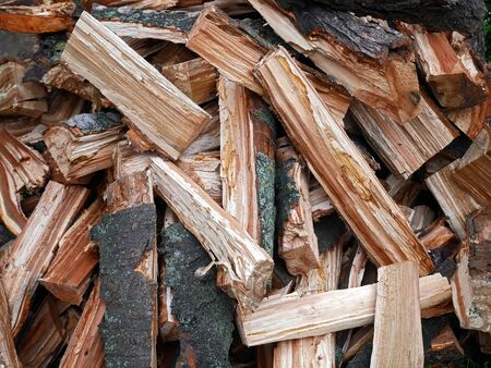 Pile of chopped firewood as natural macro textureの写真素材