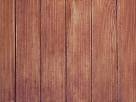 Detail of new wooden fence vertical brown parallel boardsの写真素材