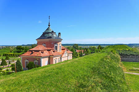 So-called Chinese Palace is one of the oldest buildings of the Zolochiv Castle Museum-Reserve, a view from the earthen fortifications embankment, a summer sunny day, Lviv region, Ukraineの写真素材