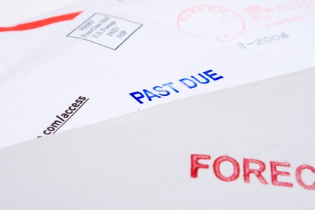Small group of envelopes marked "PAST DUE" and "FORECLOSED".  Suggesting tough economic times US.の写真素材