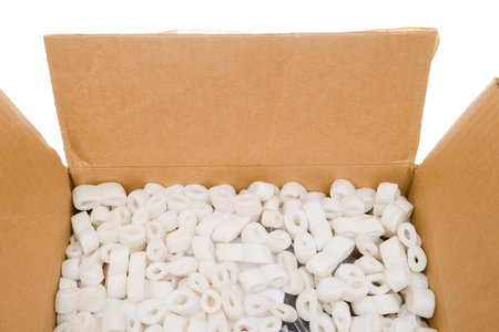 Looking into a box of packing peanuts.  Isolated on white background.