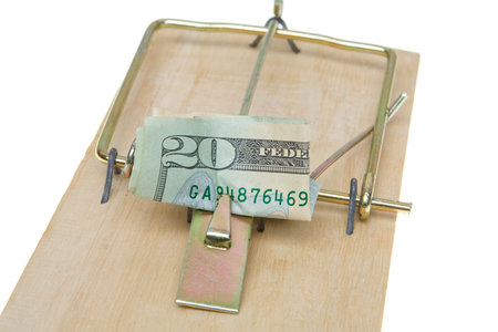 $20 folded as bait in a mousetrap.  Greed trap.