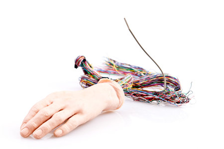 Android hand with a bundle of wires sticking out the back.  Isolated background