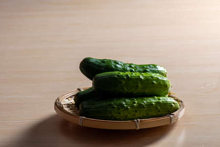 A plate of green fresh cucumbersの写真素材