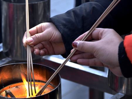 Lighting up joss stickの写真素材