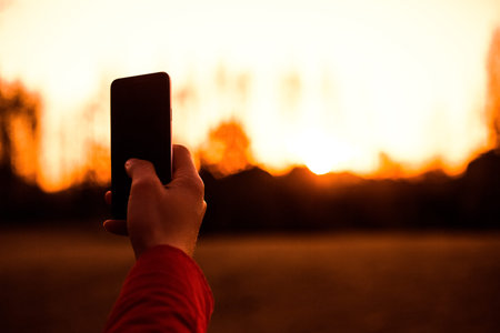 People taking pictures with phoneの写真素材